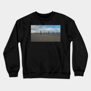 Wooden poles on the beach of Schiermonnikoog, Netherlands Crewneck Sweatshirt